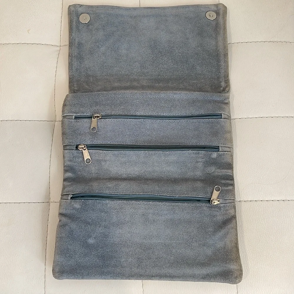 Pale blue clutch with inside zippers and vintage embellishments